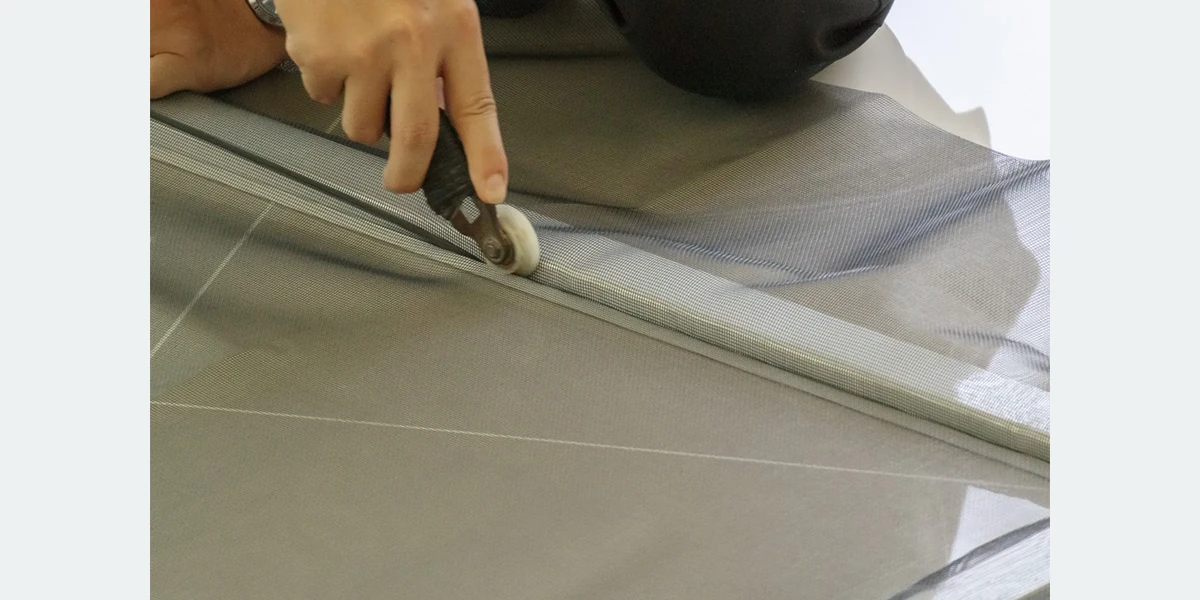 Fiberglass insect screen mesh installed on a window