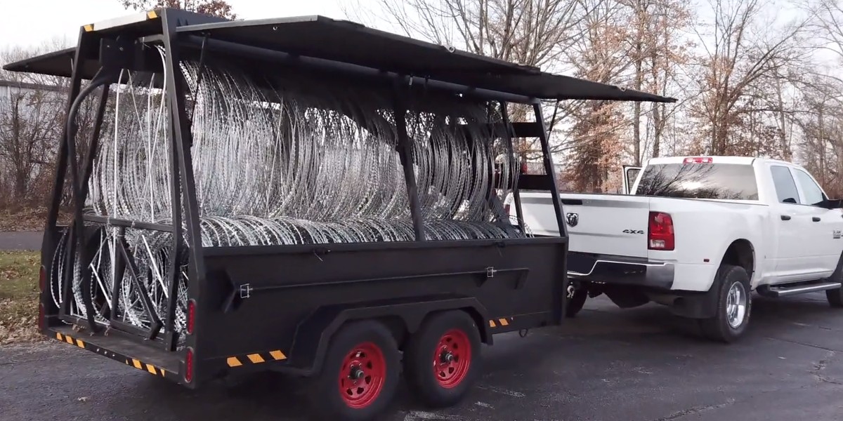 Mobile Roadblock Vehicle product image showing trailer body, warning lights and deployed barrier structure